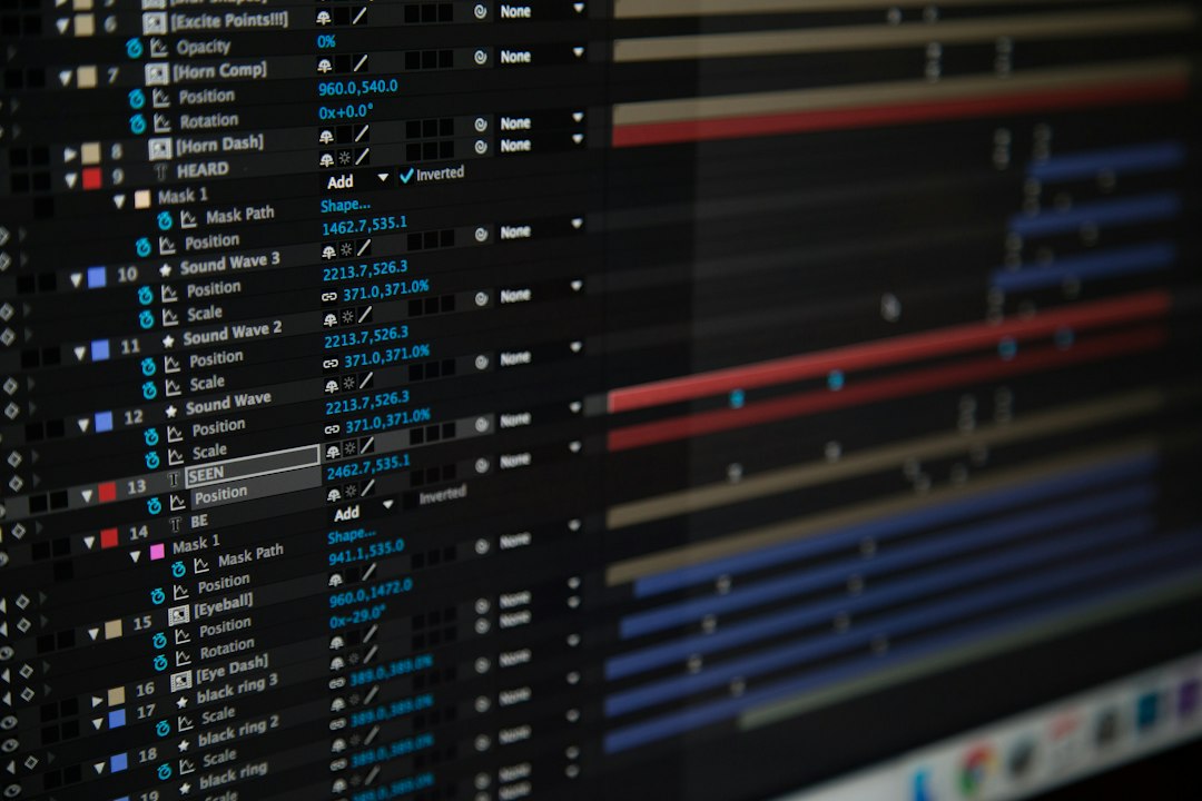 Video compositing timeline with keyframed layers on a monitor, illustrating MOV to MP4 conversion